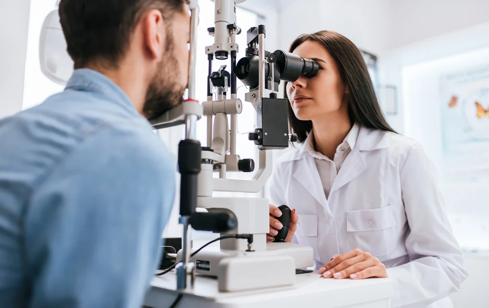 An optometrist examining a patient’s eyes