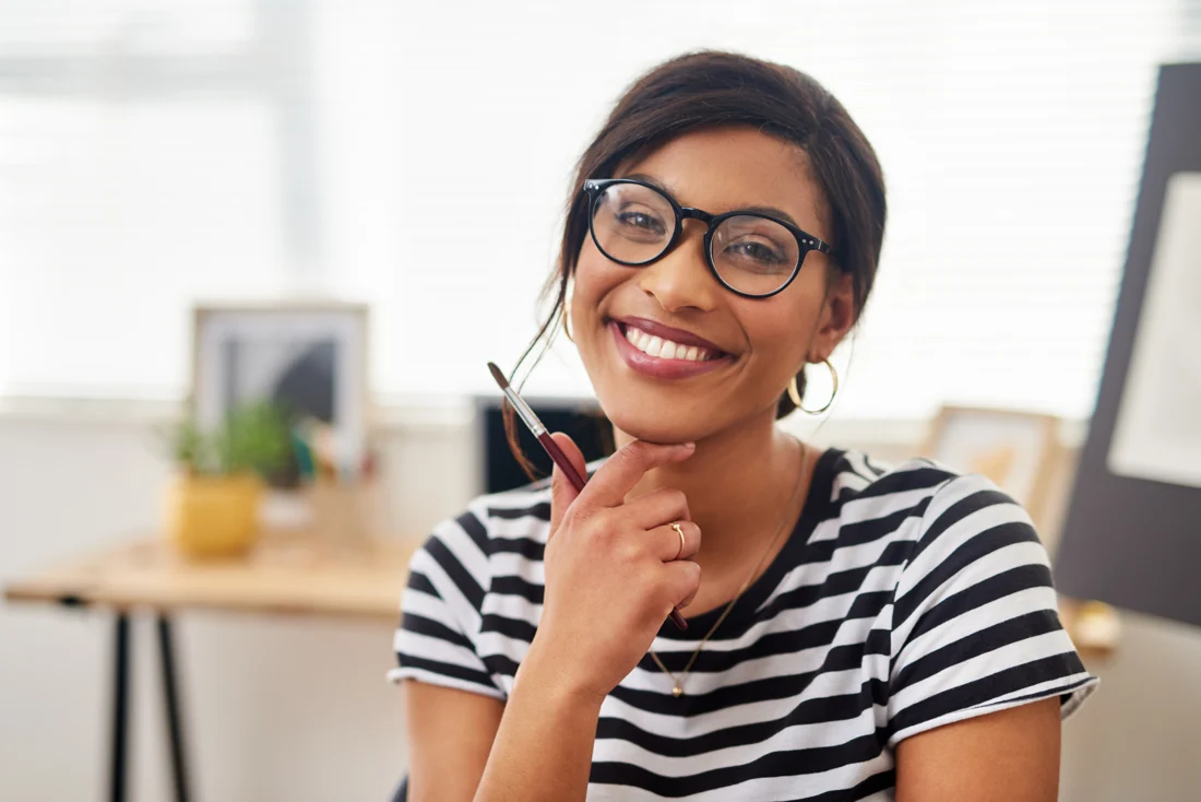 Woman wearing glasses at her desk