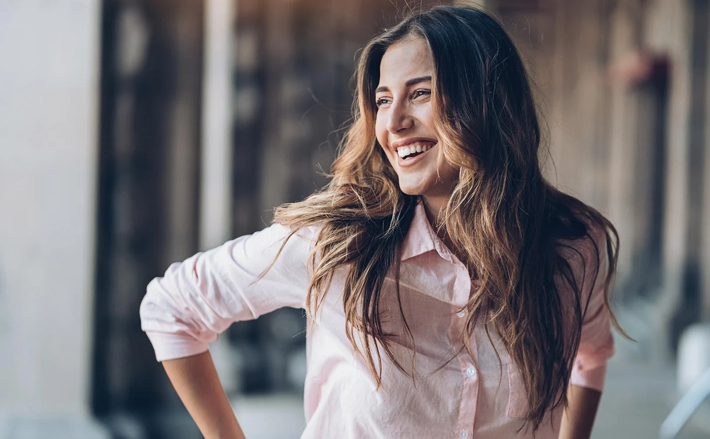 A woman enjoying a sunny day outdoors