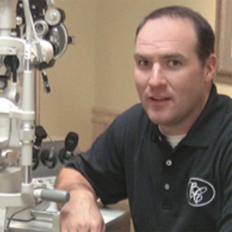 Dr. Darin Cummings sitting in exam room at office